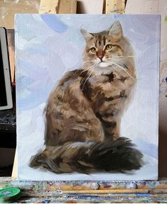 a painting of a cat sitting on top of a table next to paintbrushes