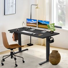 a computer desk with two monitors on it