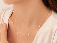 "14k Gold Pearl Necklace, Dainty Pearl Necklace, Dainty Freshwater Pearl Necklace, Bridesmaid Gifts, Pearl Jewelry, Gold Pearl Necklace * Material: High Quality 925 Sterling Silver, 14k Solid Gold, 8K Solid Gold ( you can choice it on material menu) H O W ∙ T O ∙ O R D E R - Select options from the drop-down menu - Add to cart and proceed to checkout The silver pearl necklace in the photo is the one that you will be purchasing.  Necklace will be shipped in an elegant gift box for no extra charge. C A R E ∙ I N S T R U C T I O N S Although our jewelry are high quality with extra layers of coat for long lasting, yet plated jewelry should be cleaned periodically. To extend the life of your jewelry, it's very important that you keep it dry (never bathe or spray perfume on your jewelry, chemica Anniversary Pearl Chain Necklace, Elegant Necklace With Delicate Chain For Gift, Yellow Gold Single Strand Necklace For Wedding, Delicate Formal Clavicle Chain Necklace, Delicate Bridal Necklace For Formal Occasion, Fine Jewelry Pearl Chain Necklaces For Anniversary, Dainty Single Strand Jewelry For Anniversary, Fine Jewelry Single Strand For Wedding, Single Strand Jewelry For Anniversary