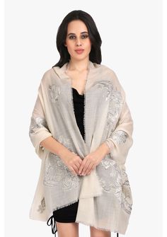 This striking ivory scarf is woven from a very fine cashmere and adorned with contrasting grey and silver flower appliques in lurex. With wispy eyelash fringes, this is perfect glam accessory over a LBD whilst keeping you comfortably warm. Elegant Cream Scarves For Festive Season, Elegant White Pashmina Shawl For Festive Occasions, Elegant White Pashmina Dupatta, Elegant Beige Scarves For Festive Season, Elegant Beige Festive Scarves, Elegant Embroidered Cream Scarves, Elegant Embroidered Cream Scarf, Elegant Cream Embroidered Scarves, Elegant Cream Embroidered Scarf