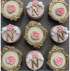 decorated cupcakes in the shape of letters n, n, and w with pink flowers