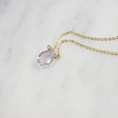 Add a touch of elegance with this handmade necklace, featuring a natural Lavender Quartz gemstone dangling in a handmade frame on a simple dainty chain. Choose your length for a choice to wear it as a choker or a long layered necklace. Simple, minimal, and elegant all-in-one necklace. Makes a great gift to add to any gemstone lover's collection. Perfect to gift for Christmas, Valentine's Day, Mother's Day, and more! Gemstone: Lavender Quartz, Scorolite Gemstone Size: 10.0 mm Gemstone Shape: Pan, Elegant Adjustable Teardrop Crystal Necklace, Elegant Purple Oval Pendant Necklace, Delicate Crystal Gemstone Necklace With Round Pendant, Elegant Teardrop Gemstone Charm Necklaces, Delicate Crystal Necklace With Round Gemstone Pendant, Elegant Adjustable Teardrop Pendant Crystal Necklace, Elegant Teardrop Gemstone Charm Necklace, Elegant Adjustable Crystal Teardrop Pendant Necklace, Elegant Purple Clavicle Chain Necklace