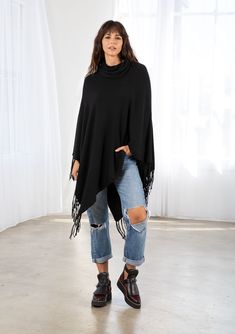 With Fall around the corner, we're craving this ultra-bohemian sweater poncho. The perfect layering style with a cozy cowl neck and an asymmetric fringed hemline. The cable knit rib adds a soft texture, while the oversized fit drapes in all the right places. FINAL SALE Cable knit Poncho style Relaxed, oversize fit Mid-length Asymmetric fringed hemline Cowl neckline Model is 5'9, garment is O/S.Style: I-50755K-QPO-NW Cozy Winter Poncho With Fringe, Knit Poncho For Fall Layering, Fall Knit Poncho For Layering, One Size Knit Poncho With Fringe, Oversized Cable Knit Poncho For Fall, Boho Sweaters, Fall Poncho, Affordable Boho, Layering Style