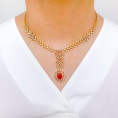 Make a statement with this Intricate Floral Ruby Diamond Set. Crafted from 18k yellow gold, this set features sparkling diamonds with a total weight of 8.34 carats, and exquisite pear-shaped rubies. The interchangeable stones allow for versatility, while the 16.75" set length and 2.25" drop length provide a striking look. Matching screw-back earrings complete the set. PRODUCT DETAILS Gold Purity(karat): 18k Item Weight(grams): 62.8 Item Finish: Yellow Gold Stone: Diamond Diamond Weight(carats): Formal Bridal Necklace In Yellow Gold With Gemstone, Formal Yellow Gold Bridal Necklace With Gemstone, Luxury Ruby Diamond Necklace With Diamond Accents, Luxury Ruby Diamond Necklace With Accents, Luxury Ruby Bridal Necklace, Formal Ruby Diamond Necklace With Brilliant Cut, Elegant Red Diamond Necklace With Brilliant Cut, Formal Red Diamond Necklace With 17 Jewels, Elegant Ruby Jewelry For Reception