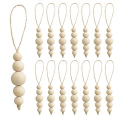 twelve wooden bead necklaces hanging from strings