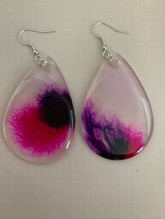 Hand made drop shaped 2 inch earrings. Made from resin and alcohol ink. Handmade Resin Teardrop Earrings As Gift, Handmade Resin Teardrop Earrings, Handmade Teardrop Resin Earrings, Unique Teardrop Resin Earrings, Handmade Teardrop Earrings For Party, Teardrop Earrings With Natural Inclusions, Resin Teardrop Earrings For Gifts, Multicolor Resin Teardrop Earrings, Multicolor Teardrop Resin Earrings