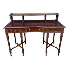 an antique desk with two drawers on one side and a shelf on the other end