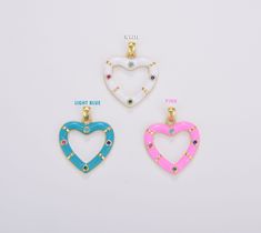 three heart shaped pendants with different colors