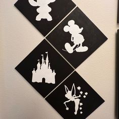 three black and white mickey mouse stickers on a refrigerator