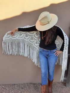 Vintage hand-crocheted white triangular-shaped shawl/wrap with fringe. No flaws, light signs of wear and no damage or stains. GORGEOUS detail and seemingly created with love while dreaming of Stevie Nicks. Made with acrylic yarn in a slightly warm shade of white (vs a bright white). * 83" W (corner to corner, almost 7') * 43" H  * 12" H of Fringe * Model is 5'8.5" White Bohemian Shawl With Fringe, Bohemian White Shawl With Fringe, Bohemian Cream Shawl With Fringe, Crocheted Shawl, Corner To Corner, Long Fringe, Long Fringes, Santa Fe Nm, Shawl Wrap