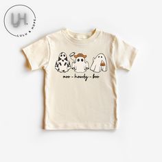 Retro Ghost Moo Howdy Boo - Halloween Shirt - Baby Toddler & Kids Size Get ready to make this Halloween unforgettable for your little ones with our exclusive Retro Trio Ghost Halloween Shirts! Designed to add a dash of spooky nostalgia to their festive attire, these shirts are available in toddler and youth sizes, ensuring a perfect fit for every age. Crafted with care and sustainability in mind, these shirts come in three charming tee color options: Deep Heather Grey, Natural, and White. 👻 Ret Playful Cartoon Print T-shirt For Fall, Playful Halloween T-shirt With Cartoon Print, Playful Pre-shrunk Tops For Halloween, Playful Crew Neck Tops For Halloween, Spooky Cotton Shirt With Character Print, Playful Cotton Tops For Halloween, Playful Fall T-shirt With Cartoon Print, White Novelty Tops With Character Print, Unisex Short Sleeve Halloween T-shirt