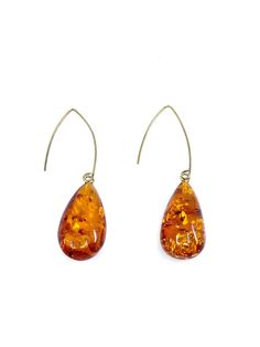 Spectacular Long Earrings made by Polish Designer Stone: Baltic Cognac Amber Sterling Silver Earrings SKU: AMER082823-02 Dimensions: Stones are approx. 1.25" long x .75" wide x 2" depth Length: Hang approx. 2.5" long Material: Gold Plated Silver Hooks Statment Earrings, Silver Statement Earrings, Stone Design, Gold Plated Silver, Long Earrings, Cognac, Statement Earrings, Sterling Silver Earrings, Silver Plate