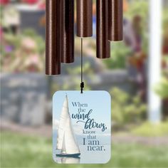 a wind chime with a sailboat on it