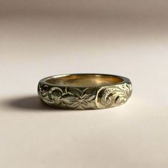 a wedding ring with an intricate design on it