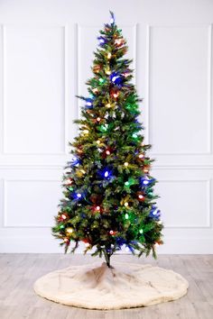 a small christmas tree with multicolored lights