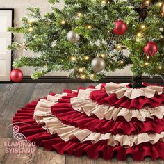 a christmas tree with red and white ruffled skirt