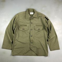 VINTAGE ' Military Army Faded Green Fatigue OG Button Down Shirt sz Lrg Adult CONDITION : Wear and fading from age. Stains/ marks around front, sleeves and back. Missing name patches. Great fading throughout. Overall good condition! This shirt has been washed* - Please review pictures* TAGGED SIZE : ** Mens Adult L** ( Fits : Mens L ) MEASUREMENTS : *Please see photos above for measurements. *Disclaimer: All measurements are in inches and are taken laying flat on the ground* *Please review pictu Name Patches, Military Army, Vintage Military, Mens Oxfords, Button Downs, Overalls, Button Down Shirt, Tee Shirts, Bathing Beauties