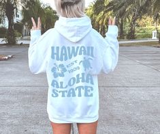 Hawaii Beach Surf Hoodie, Hawaii Aloha Hoodie, Oversized Hoodie, Trendy Hoodie, Tumblr Hoodie, Aesthetic Hoodie, VSCO Hoodie, Words On Back Make a statement on the beach this season with our new trendy Hawaii words back hoodie! With its trendy design and bold, vibrant colors, this hoodie is sure to turn heads and capture attention. The playful typography and retro design add a touch of nostalgia and fun to your outfit, while the vibrant colors are perfect for capturing that laid-back island vibe Hawaii Words, Surf Hoodie, Vsco Hoodie, Hawaii Aloha, Trendy Hoodies, Aesthetic Hoodie, Hawaii Beach, Beach Surf