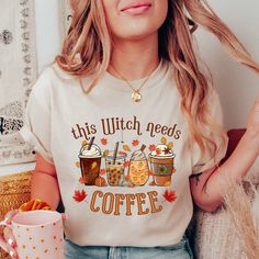 Looking for the perfect fall shirt to show off your love for coffee and all things spooky? Look no further than our "This Witch Needs Coffee" t-shirt! With a playful design, this pumpkin shirt is perfect for coffee lovers and Halloween enthusiasts alike. Whether you're enjoying a crisp autumn morning or getting into the Halloween spirit, this shirt is sure to be a hit. So grab your favorite mug and get ready to brew up some fun in our "This Witch Needs Coffee" t-shirt! This classic unisex jersey Funny Graphic Print Shirt For Fall, Relaxed Fit Coffee Color Tops For Fall, Fall Season Relaxed Fit Shirt With Custom Print, Fall Custom Print Shirt With Relaxed Fit, Coffee Colored Tops With Letter Print For Fall, Coffee Letter Print Tops For Fall, Fall Relaxed Fit Shirt With Custom Print, Relaxed Fit Shirt With Custom Print For Fall, Custom Print Shirt With Relaxed Fit For Fall