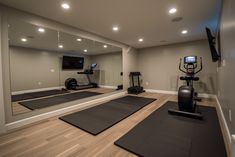 a home gym with treadmills and exercise mats