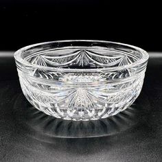 a glass bowl sitting on top of a table