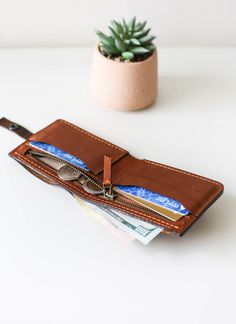 Slim Leather Wallet, Billfold Wallet with Zipper, Mens Wallet, Brown Billfold Leather Wallet, Gift for Him Introducing The most practical, Brand New, Unisex  Leather wallets! The most Fun and Minimalist wallet line ever. * Water-splash proof and Durable. * Minimalist, Unisex Design. * The most practical wallet design. * Unisex Design. * Super secure buttons snap closure. * Soft Natural Leather. * Card, interior zipper and Cash slots, according to the interior style of your choosing. * Optional i Brown Bifold Wallet With Zipper Pocket, Leather Bifold Wallet With Zipper Pouch, Bifold Wallet With Zipper Pouch For Everyday Use, Bifold Wallet With Zipper Pouch, Everyday Bifold Wallet With Zipper Pouch, Leather Bifold Coin Purse With Zipper, Bifold Wallet With Zipper Pocket As Gift, Bifold Wallet Men, Large Leather Bag