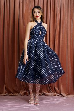 Navy & White Polka Dot Flared Dress Criss Cross Halter with keyhole Thick waist band with a smock back Long Halter Straps- Tie back at neck Full Fit & Flare Midi Skirt Fabric Content : 100% Polyester Size & Fit Model MeasurementS Gina (Wearing Size S) Bust: 33" Waist: 26" Hips: 37" Height: 5’8" Flare Midi Skirt, Cotton Box, Open Back Maxi Dress, Midi Flare Skirt, Skirt Fabric, Flared Dress, Halterneck Dress, Box Pleats, Waist Band