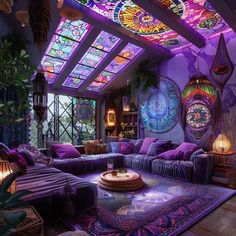 a living room filled with lots of purple furniture and stained glass windows above the ceiling