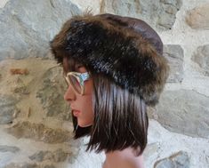 A vintage French brown leather hat with deep faux fur band. It is lined with quilted black fabric and is in great condition. Label: Willy's Paris Made in France 100% cuir (leather) Lining 100% Acrylic Creations Rey82300 Caussade Style: Glady's 656 Height to top of crown: about 7.5 inches (19 cm) Depth of fur band: 3.5 inches (9 cm) Inside brim circumference: 25 inches (64 cm)  If you are purchasing several items from my shop, please contact me before buying and I will create a special reserved l Fur Band, Brown Leather Hat, Paris Hat, Faux Fur Hat, Leather Hat, Leather Hats, Fur Hat, Hats Vintage, Vintage French