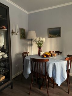 a dining room with a table and chairs