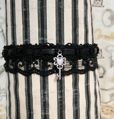 All my items are handmade! I have choker bands with two different finishes; a matte velvet, and a faux leather. The back of both styles (the part that will contact the skin) is the same, and is composed of soft material. The finish on the band does not actually touch the skin, so should you like the faux leather look better, you can be assured that you won't actually end up with faux leather material against the skin of your neck. All my chokers are sewn by me. I pre-wash all my lace before sewing. From the trim to the lace to the charm, I sew each piece together. Every choker has a length of elastic on each side so that they are adjustable. You can tie the choker as tight or loose as you'd like, and this ensures that they can fit anyone! If you tie the knot like a sneaker bow, then you ca J Goth, Steampunk Heart, Goth Choker, Skeleton Key Necklace, Black Lace Choker, Choker Black, Handmade Chokers, Lace Choker, Heart Key