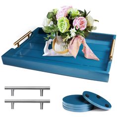 a blue tray with flowers and two matching plates