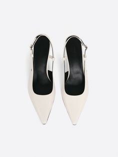 Editor's NotesRareness' shoes are designed for comfortable and elevated essential styles.- Slingback heeled pumps- Subtle glossy leather- Adjustable buckle strap- Kitten heel- Glossy leather texture- Slim pointed toe- Minimal and chicMeasurements(in.)- Size:: KR 225MM(US 5.5) ~ KR 260MM(US 9)- Heel height: 2.4  in* Fits true sizeComposition & Care- UPPER:  Cow Leather- LINING: Pigskin Leather- INSOLE: Kidskin Leather- Avoid direct heat and moisture- Professional cleaning is recomme Modern Heels With Buckle Closure And Pointed Toe, Patent Leather Slingback Pumps With Removable Insole For Office, Business Slingback Pumps With Sculpted Heel And Ankle Strap, Business Slingback Heels With Padded Heel, Business Slingback Heels With Heel Strap, Business Slingback Heels With Buckle Closure, Business Heels With Ankle And Heel Straps, Office Slingback Pumps In Patent Leather, High Heel Slingback Pumps With Removable Insole For Office