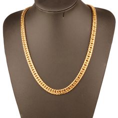 Transform any outfit with our luxurious chunky gold chain necklace. Made with high-quality materials, this necklace exudes elegance and sophistication. Elevate your style with this timeless piece and make a statement wherever you go. A must-have for any fashion-forward individual. Occasion : PartyCompatibility : All CompatiblePendant Size : No pendantShape\pattern : GeometricModel Number : NoneMaterial : MetalChain Type : Link ChainStyle : PunkNecklace Type : Chains NecklacesGender : MenMetals T Classic Long Gold Chain Necklace, Classic Gold Necklace With Chunky Chain, Elegant Gold Cuban Link Necklace With Box Chain, Gold Long Necklace With Chunky Chain, Luxury Long Gold Chain Necklace, Gold Chunky Chain Long Necklace, Gold Cuban Link Necklace With Chunky Chain, Gold Cuban Link Chunky Chain Necklace, Luxury Gold Necklaces With Chunky Chain