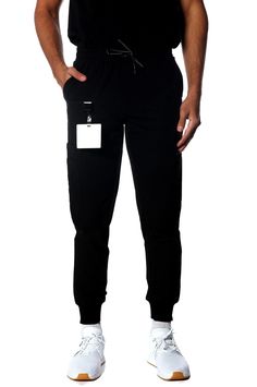 PRICES MAY VARY. SMART STORAGE WITH 11 POCKETS: Multiple pockets, including 2 Trouser pockets, 2 Back Welt pockets, 1 Tech pocket, Cargo pockets on both sides (3 pockets each side), providing ample storage space for your essential items like hospital equipment and supplies. JOGGER-STYLE FIT AND RIBBED CUFFS: Tapered and fitted design that is more tailored than traditional scrub pants, and Elastic or ribbed cuffs at the ankles for a modern, athletic look. CONTEMPORARY STYLE AND VERSATILE WEAR: Ex Hospital Uniform, Hospital Scrubs, Hospital Equipment, Hospitality Uniform, Uniform Shop, Mens Jogger Pants, Trouser Pocket, Safety Clothing, Athletic Looks