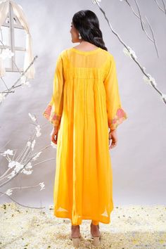 Mango yellow gathered anarkali with floral embroidered sleeves and cross smock details. Comes with leggings and slip. - Aza Fashions Spring Anarkali Cotton Silk Kurta, Anarkali Cotton Silk Kurta For Spring, Yellow Chanderi Anarkali Set With Dabka, Traditional Cotton Silk Anarkali Set For Spring, Traditional Spring Anarkali Set In Cotton Silk, Yellow Dabka Anarkali Set For Diwali, Chanderi Long Sleeve Kurta With Yoke, Spring Designer Anarkali Set With Cutdana, Yellow Cotton Silk Kurta For Spring