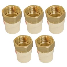 four brass fittings are shown on a white background