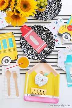 a table topped with lots of different types of crafts and paper items on top of each other