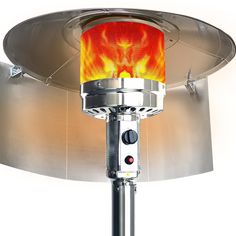 a fire pit sitting on top of a metal table next to a round light fixture