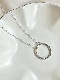 Twisted Open Circle Necklace Life Circle Pendant Fertility Necklace Karma Necklace Delicate Circle Outline Ring Link Girlfriend Gift Idea  DETAILS  - Metal is sterling silver  - Hand-shaped, forged, soldered, and hammered - Circle size is approx 40 mm You can find the matching earrings here:  https://reemjewelryboutique.etsy.com/listing/1658645294 Matching Heart Pendant Nevklace:  https://reemjewelryboutique.etsy.com/listing/1672117409 PACKAGING  Your orders will come to you packaged with care. I make sure each order will arrive beautifully packaged in an elegant gift box, ready for gifting. VISIT OUR SHOP FOR MORE: http://www.etsy.com/shop/reemjewelryboutique  FOLLOW US ON SOCIAL MEDIA FOR THE SNEAK PEAKS, NEW PRODUCTS AND OCCASIONAL COUPON CODES. 📷 Instagram https://www.instagram.com/re Adjustable Hoop Sterling Silver Jewelry, Dainty Silver Round Pendant Jewelry, Sterling Silver Hoop Jewelry As Gift, Sterling Silver Hoop Jewelry Gift, Sterling Silver Hoop Jewelry For Gifts, Sterling Silver Rings With Silver Chain For Gift, Dainty Hoop Necklaces As Gift, Dainty Sterling Silver Hoop Jewelry, Personalized Sterling Silver Hoop Jewelry