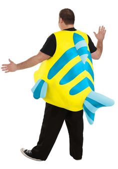 a man in a yellow and blue fish costume