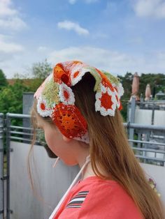 Crochet Bandana: Knitted Flowers in Yellow, Red, and Green Add a burst of color to your style with this crochet bandana adorned with knitted flowers in vibrant yellow, rich red, and lush green. Meticulously crafted, this accessory radiates with playful elegance and whimsical charm, perfect for infusing your ensemble with a touch of floral delight. Whether worn casually or for special occasions, it promises to elevate your look and make a statement. Embrace the beauty of handmade craftsmanship an Multicolor Bandana Headband For Spring, Multicolor Headband Bandana For Spring, Spring Multicolor Headband For Festival, Multicolor Headband For Spring Festival, Spring Festival Multicolor Headband, Red Bohemian Crochet Hat For Spring, Spring Red Crochet Hat One Size, Red Crochet Hat For Spring, One Size, Bohemian Red Crochet Hat For Spring