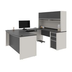 an office desk with two computer monitors on top of it and drawers underneath the desk