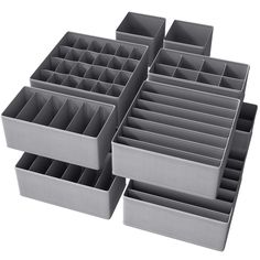 six gray plastic drawers with dividers on each side