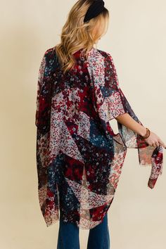 Add a touch of boho chic to your wardrobe with our Floral Fantasy Kimono. This stylish and comfy piece features a beautiful floral pattern that will elevate any outfit. Perfect for a cute and trendy look, whether you're hitting the beach or strolling through the city. #lovemyleto 100% Polyester Imported Trendy Spring Festival Kimono, Bohemian Kimono With Abstract Print For Vacation, Multicolor Print Kimono For Spring Beach Cover-up, Bohemian Multicolor Print Kimono For Spring, Chic Kimono For Vacation, Trendy Summer Kimono For A Day Out, Multicolor Floral Print Kimono One Size, Red Floral Print Kimono For The Beach, Hippie Style Kimono For Beach In Fall