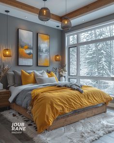 a bedroom with yellow and gray bedding in front of a large window that looks out onto the snow covered trees