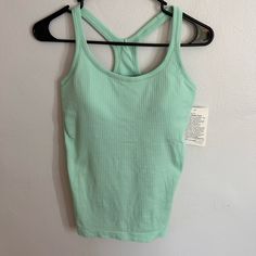 New With Tags. Size 6. Built In Sports Bra With Removable Pads. Mint Green Color. Casual Seamless Activewear For Light Sports, Casual Activewear For Light Activity, Casual Green Tank Top For Light Exercise, Green Functional Tops For Light Exercise, Casual Green Tops With Light Support, Green Racerback Top For Light Exercise, Green Moisture-wicking Tank Top For Light Sports, Green Tank Top For Light Sports In Summer, Green Athleisure Tank Top For Light Sports