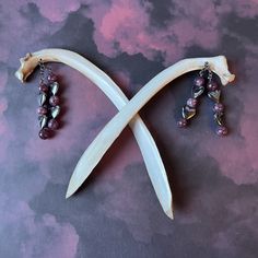 Decorate your hair with these one-of-a-kind ~ set of two ~ deer rib bone hair sticks! 🖤💜 Please see photo of measurements for sizes!!   🖤💜 HIGHLIGHTS *real deer bone hair sticks, lightly painted, sanded tips, and clear coat varnish for protection *Lepidolite and Hematite stones and metal spacers *nickel free metal chain 🖤💜 ARTIST NOTES I design and handcraft all art pieces in my smoke-free home with my two dogs. No animals are harmed to make your art.  My pieces are one of a kind, and I put my heart and soul into bringing new life to these animals through art. My pieces are delicate and fragile, please handle with care. I craft all pieces to last using industrial-strength adhesives. I welcome your questions and I love doing custom pieces. Please message me your inquiries. Please read Bone Hair Clip Aesthetic, Bone Hair Clip, Bone Hair Stick, Elk Horn Hair Stick, Witchy Hair, Resin Wood Hair Stick, Rib Bones, Antler Crafts, Bone Crafts