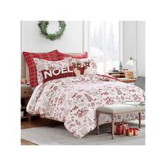 a christmas themed bed with red and white comforter