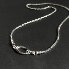 This Solid Sterling Silver Rounded Box Chain Necklace is ideal for creating a classic, timeless look. This weighty, high-quality sterling silver chain is complete with a large oval push clasp, allowing for interchangeable pendants. Details: Chain: Solid Sterling Silver rounded box chain, 2.5mm Clasp: Solid Sterling Silver hinged oval push clasp, 22mm Sizes: 16 inches to 24 inches Shipping: Ready to ship within one business day Complimentary shipping in the USA Complimentary gift wrap Sterling Silver Chain Necklace With Oval Pendant, Silver Oval Cable Chain Necklace, Silver Oval Necklace With Cable Chain, Minimalist Oval Silver Chain Jewelry, Minimalist Oval Jewelry With Silver Chain, Classic Oval Silver Chain Necklace, Oval Sterling Silver Chain Necklace In White Gold, Oval White Gold Sterling Silver Chain Necklace, Classic Silver Chain Necklace With Oval Pendant